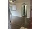 Bright living room with wood-look floors and access to kitchen at 11568 Westwood Blvd # 1034, Orlando, FL 32821