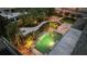 Elevated view of a luxurious backyard pool and landscaping at 13005 Islamorada Dr, Orlando, FL 32837