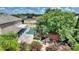 Aerial view of house, pool, and landscaped backyard at 13005 Islamorada Dr, Orlando, FL 32837