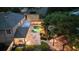 Aerial view of home, pool, and pergola at dusk at 13005 Islamorada Dr, Orlando, FL 32837