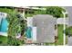 Aerial view of a house with a large backyard and pool at 13005 Islamorada Dr, Orlando, FL 32837