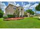 Two-story house with a three-car garage and manicured lawn at 13005 Islamorada Dr, Orlando, FL 32837