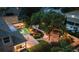 Aerial view of house, pool, and landscaped backyard at night at 13005 Islamorada Dr, Orlando, FL 32837