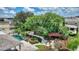 Expansive backyard oasis with lush landscaping, pool, and pergola at 13005 Islamorada Dr, Orlando, FL 32837