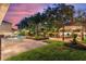 Expansive backyard with a pool, pergola, and lush landscaping at 13005 Islamorada Dr, Orlando, FL 32837