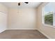 Bright bedroom with neutral walls, carpet flooring, and window blinds at 13005 Islamorada Dr, Orlando, FL 32837