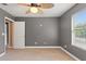 Spacious bedroom with neutral walls, carpet flooring, and ceiling fan at 13005 Islamorada Dr, Orlando, FL 32837