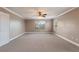 Large bedroom with carpeted floor and ceiling fan at 13005 Islamorada Dr, Orlando, FL 32837