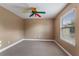 Well-lit bedroom with neutral walls and ceiling fan at 13005 Islamorada Dr, Orlando, FL 32837