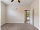 Bedroom with carpet, ceiling fan and access to backyard at 13005 Islamorada Dr, Orlando, FL 32837