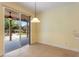 Bright breakfast nook with sliding glass doors to backyard at 13005 Islamorada Dr, Orlando, FL 32837