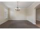 Bright dining room with neutral walls and carpeting at 13005 Islamorada Dr, Orlando, FL 32837