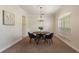 Charming dining room with a round table, chandelier, and window at 13005 Islamorada Dr, Orlando, FL 32837