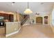 Island kitchen with granite countertops and dark cabinets at 13005 Islamorada Dr, Orlando, FL 32837