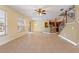 Large living area with tile floors and kitchen views at 13005 Islamorada Dr, Orlando, FL 32837