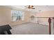 Spacious loft area with wood railing and ceiling fan at 13005 Islamorada Dr, Orlando, FL 32837