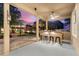 Outdoor kitchen with bar seating and built-in appliances at 13005 Islamorada Dr, Orlando, FL 32837