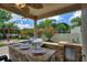 Outdoor kitchen with granite countertop and built-in grill at 13005 Islamorada Dr, Orlando, FL 32837