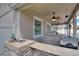 Outdoor kitchen with granite countertop and built-in grill at 13005 Islamorada Dr, Orlando, FL 32837