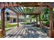 Pergola patio with pathway and view of home and pool at 13005 Islamorada Dr, Orlando, FL 32837