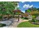 Charming pergola with brick pathway and beautiful landscaping at 13005 Islamorada Dr, Orlando, FL 32837
