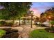 Charming pergola-covered patio with string lights at 13005 Islamorada Dr, Orlando, FL 32837