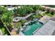 Aerial view of a backyard pool and surrounding landscaping at 13005 Islamorada Dr, Orlando, FL 32837