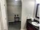 Bathroom with vanity sink and an open closet at 14501 Grove Resort Ave # 1407, Winter Garden, FL 34787