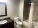 Cozy bathroom with tile surround, a bathtub with shower, and a granite-topped vanity at 14501 Grove Resort Ave # 1407, Winter Garden, FL 34787