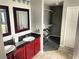 Elegant bathroom with double vanities, granite counters, and a walk-in closet at 14501 Grove Resort Ave # 1407, Winter Garden, FL 34787