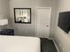 Bedroom featuring a comfortable king-size bed and an entertainment system at 14501 Grove Resort Ave # 1407, Winter Garden, FL 34787