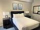 Bedroom featuring a comfortable king-size bed, with matching nightstands at 14501 Grove Resort Ave # 1407, Winter Garden, FL 34787