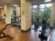 Bright fitness center with modern equipment and large windows offering scenic views at 14501 Grove Resort Ave # 1407, Winter Garden, FL 34787