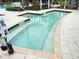 Relaxing hot tub with tile surround and convenient access steps for ultimate comfort at 14501 Grove Resort Ave # 1407, Winter Garden, FL 34787