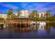 Picturesque lakefront gazebo with boat access, offering serene views of the community and surrounding nature at 14501 Grove Resort Ave # 1407, Winter Garden, FL 34787