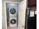 Stacked washer and dryer laundry unit at 14501 Grove Resort Ave # 1407, Winter Garden, FL 34787