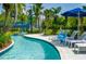 Enjoy the community lazy river with comfortable lounge seating and beautifully landscaped surroundings at 14501 Grove Resort Ave # 1407, Winter Garden, FL 34787