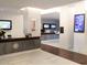 Inviting lobby area with front desk, comfortable seating, and artwork for guests and residents at 14501 Grove Resort Ave # 1407, Winter Garden, FL 34787