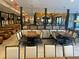 Spacious restaurant interior with modern tables, chairs, and decorative partitions at 14501 Grove Resort Ave # 1407, Winter Garden, FL 34787