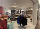 Well-stocked retail shop with clothing racks and displays of merchandise for sale at 14501 Grove Resort Ave # 1407, Winter Garden, FL 34787