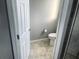 Clean and well-maintained toilet area adjacent to the shower and bathroom at 14501 Grove Resort Ave # 1407, Winter Garden, FL 34787