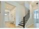 Bright entryway with staircase and light wood flooring at 16000 Volterra Pt, Montverde, FL 34756