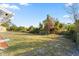 Large grassy backyard with a chain link fence at 1609 Stocking St, Daytona Beach, FL 32117