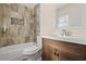 Bathroom featuring a large vanity and updated tile shower/tub combo at 1609 Stocking St, Daytona Beach, FL 32117