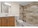 Bathroom with shower and wood vanity at 1609 Stocking St, Daytona Beach, FL 32117