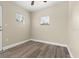 Bright bedroom with wood-look floors and ceiling fan at 1609 Stocking St, Daytona Beach, FL 32117