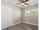 Bedroom with double door closet and window with blinds at 1609 Stocking St, Daytona Beach, FL 32117