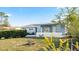 Charming ranch home with freshly painted exterior and well-manicured lawn at 1609 Stocking St, Daytona Beach, FL 32117