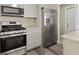 Stainless steel appliances and granite countertops in this kitchen at 1609 Stocking St, Daytona Beach, FL 32117