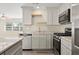 Modern kitchen with stainless steel appliances and granite countertops at 1609 Stocking St, Daytona Beach, FL 32117